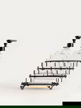 Set 2 dozatoare sapun/detergent lichid si suport Nerja, Homla, 22x10.5x19.5 cm, sticla/plastic/metal, negru/transparent